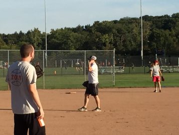 Applied Master's students and PhD students play baseball 